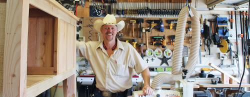 Owner Paul Adams runs his woodworking business from his garage in Magnolia.