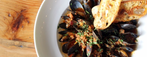 Texas Spicy Mussels ($12) are topped with chorizo and served with grilled crostini.
