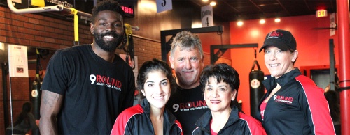 Steve Krusemark, third from left, and his wife, Zoila, fourth from left, run 9 Round Kickboxing with a team of trainers who are experienced in various forms of fitness, from aerobics to martial arts. 