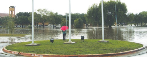 Heavy flooding left areas of Central Texas, including Hays County, under water twice in 2015. An evacuee watches rising water near the San Marcos Activity Center, where residents in flood-prone areas of the city were sent for safety during flooding Oct. 30 of that year. According to the city of San Marcos, 92 properties in the city were destroyed during floods in May. No properties were destroyed by the October 2015 flood, according to the city. 