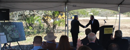 Shaun Cranston, senior vice president of Brookfield Residential, shakes hands with Will Conley, Hays County Pct. 3 commissioner, at the groundbreaking of Kissing Tree, a new neighborhood in San Marcos. 