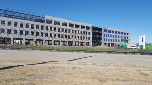 Telecommunications equipment supplier Alcatel-Lucent is constructing a four-story office building off Independence Parkway just south of Plano Parkway.