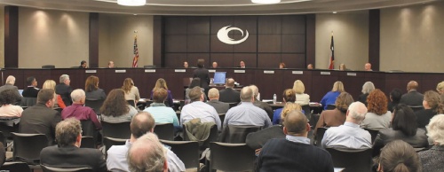 A crowd listens to the Collin College board of trustees at its Feb. 23 meeting.