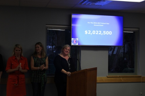 Eanes Education Foundation Treasurer Annie Zucker (far right) announces the $2 million grant at the Eanes ISD Board of Trustees meeting April 26.