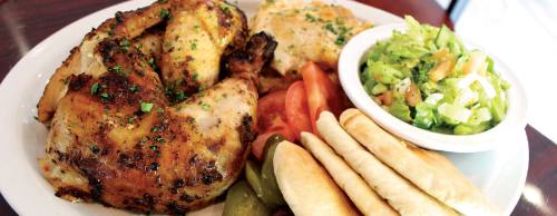 The rotisserie chicken plate is a popular dish served at the restaurant, featuring chicken, scalloped potatoes and tahini salad.