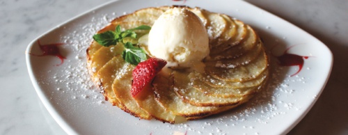 The apple tart, topped with ice cream, is a popular dessert ($8.99).