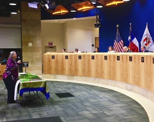 Northwest Austin resident Idee Kwak put on a dramatic performance in opposition of Austin Oaks that involved a to-scale diorama of 700 trees, roughly $6,000 in cash and broken eggs.   