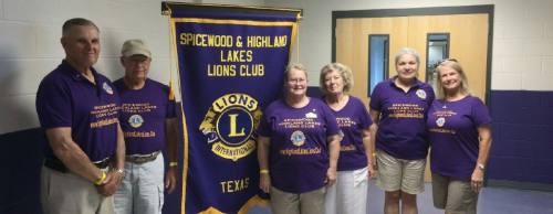 From left: President Paul Kronbergs, Jack Moran, Linda Eicher, Liz Almond, Selby and Vannette Poole at a vision screening in 2016 where 200 children were tested.