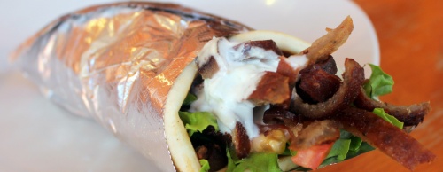 Gyro meat is shaved off a vertical rotisserie and wrapped inside pita bread with tomatoes, lettuce, onions and tzatziki sauce ($6.99).