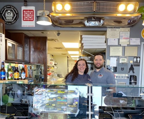 Samantha and Curtis Whalen took over ownership of Pizza Delight in Round Rock on May 3. (Trent Thompson/Community Impact Newspaper)