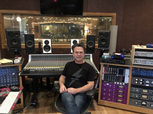 Andre Moran, Cedar Creek Recording chief engineer, sits in the studio. (Glorie Martinez/Community Impact Newspaper)