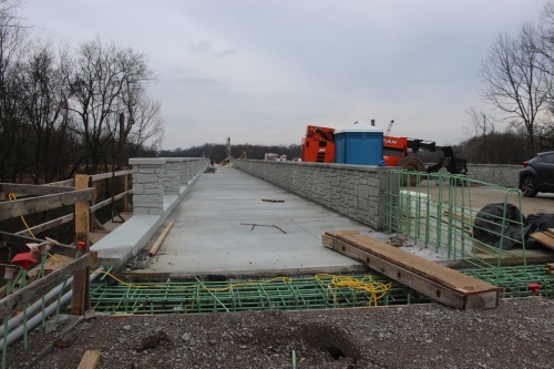 A photographic view from near Carothers Parkway of a bridge under construction at the future Southeast Municipal Complex entrance taken in March 2022. (Martin Cassidy/Community Impact Newspaper) 