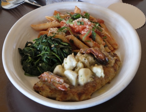 The Snapper Special (market price): Penne pasta is served with tomato sauce, spinach and red snapper. (George Wiebe/Community Impact Newspaper)