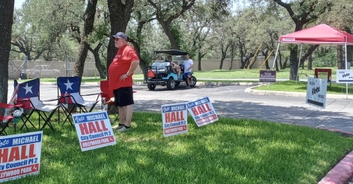 Hollywood Park City Council candidates Todd Kounse and Michael Hall appeared alongside friends and supporters at City Hall, 2 Mecca Drive, to greet voters on Election Day, May 7. (Edmond Ortiz/Community Impact Newspaper)