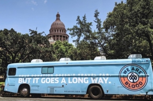 The We Are Blood mobile bus parked outside the Texas Capitol