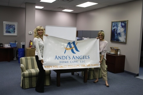 Owner and CEO Andrea Taubman (right) and Administrative Manager Jamie Markey (show off an Andi's Angels banner. (Summer El-Shahawy/CommunityImpactNewspaper)