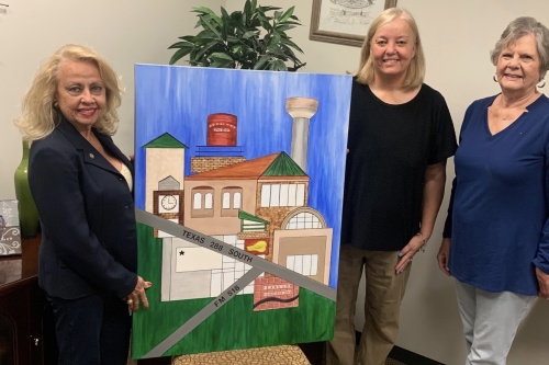 From left, Pearland Arts League Chair Naomi Stevens; Teir Allender, Pearland Town Center Mall senior manager; and Margo Green, Pearland Arts League Exhibit Gallery chair, pose at the Pearland Town Center. (Courtesy Naomi Stevens)