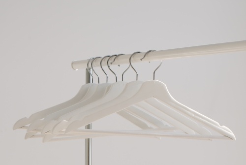 White hangers on a rack