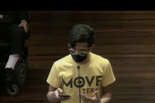 Aaron Arguello, San Antonio advocacy organizer with MOVE Texas, addresses Bexar County commissioners Sept. 6 about increasing the number of local polling sites for the Nov. 8 general election. (Courtesy Bexar County)
