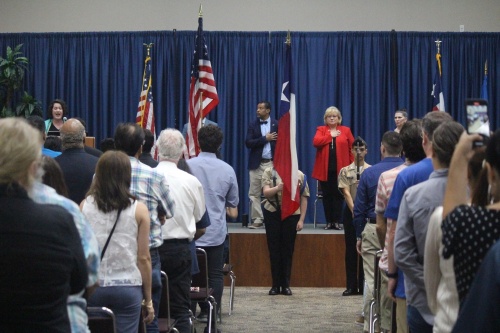 Students from Tomball High School’s Naval JROTC presented the flags for the Star-Spangled Banner sung by Lisa Morales, chair of the LSC-Tomball Music Department, during the Sept. 17 naturalization ceremony in Tomball. (Anna Lotz/Community Impact Newspaper)