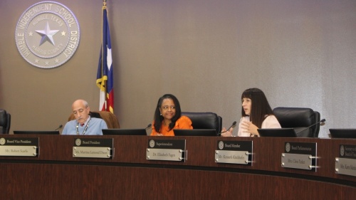 Humble ISD board of trustees President Martina Lemond Dixon (center) removed an item that would have allowed the board to consider removing Trustee Robert Scarfo (left) from all board committees during a Sept. 13 meeting. (Wesley Gardner/Community Impact Newspaper)