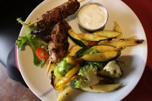 Moroccan kefta kebabs ($8.95) feature ground steak with minced peppers and spices, served with two sides. (Kara 