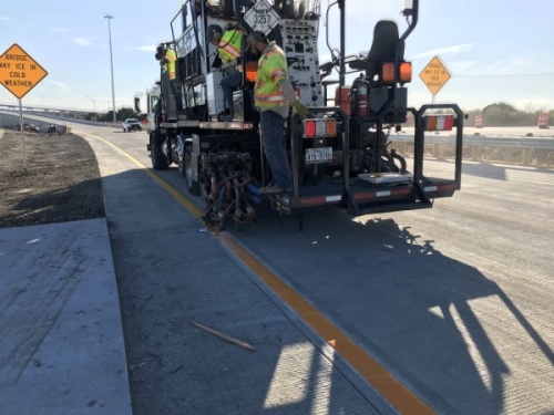 Workers are finishing striping the pavement for the new southbound SH 130 to westbound Toll 290 flyover that opens the weekend of Jan. 11. (Courtesy Central Texas Regional Mobility Authority)