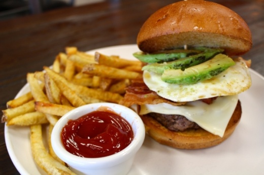 The Brazilian burger ($7.99/$11.79 combo) is topped with bacon, Swiss cheese, avocado slices and a fried egg. Ben Thompson/Community Impact Newspaper