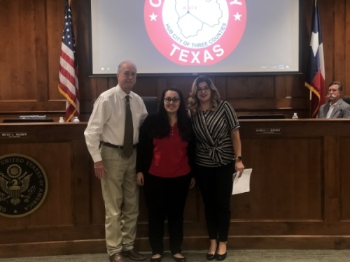 The city of Katy recognized Brenda Mendiola (center) for completing the Level I and Level II Court Clerk’s Certification Program from the Texas Municipal Court Clerk’s Certification Program at the Jan. 13 meeting. (Nola Z. Valente/Community Impact Newspaper)