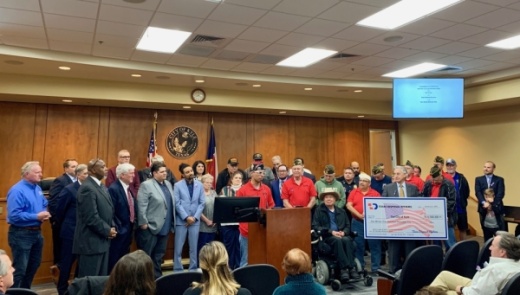 Texas Disposal Systems presented a symbolic check for $1.5 million to the city of Kyle. (Community Impact Newspaper staff)