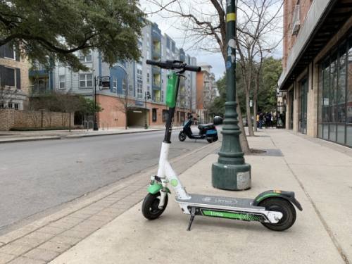 New dockless vehicles, such as Revel mopeds, have entered the Austin market, in addition to electric scooters, pictured here in West Campus. (Emma Freer/Community Impact Newspaper)