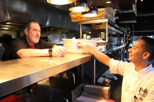 Chefs Bob Stephenson (left) and Carlos Arevalo (right) have been working together for about 21 years. They opened FnG Eats together in Keller in 2012. (Renee Yan/Community Impact Newspaper)
