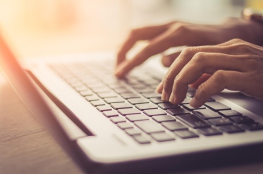 adobe stock image hands typing on laptop keyboard