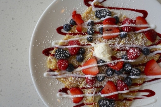 The Very Berry Crepe ($9.99) is topped with fresh berries, mascarpone cheese and vanilla and berry glazes.(Gavin Pugh/Community Impact Newspaper)