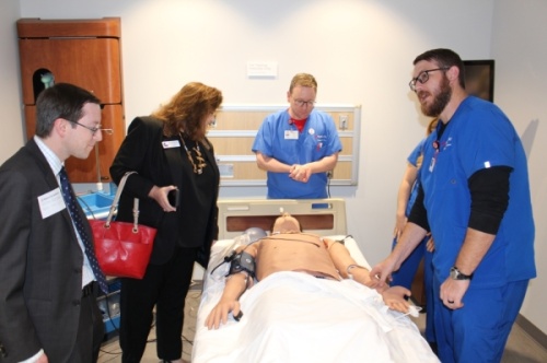 Plano Deputy Mayor Pro Tem Anthony Ricciardelli and Collin County Commissioner Susan Fletcher learn about the Center for Clinical Advancement's interactive mannequins. (William C. Wadsack/Community Impact Newspaper)