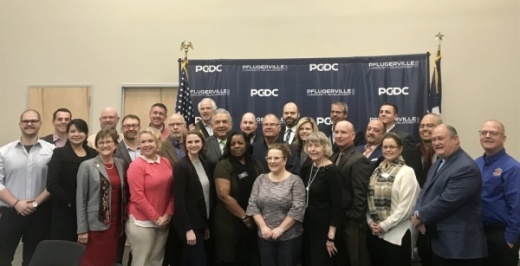 Local leaders and community members involved in the implemention of the Pflugerville Community Development Corp.'s Comprehensive Economic Development Strategy 2.0 plan attended the PCDC's press conference Feb. 12. (Kelsey Thompson/Community Impact Newspaper)
