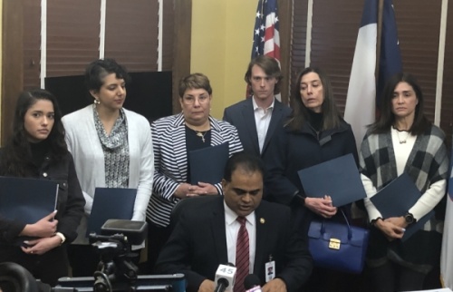 Fort Bend County Judge KP George reads a statement during a press conference Feb. 11 with the families of the Citgo 6, businessmen who have been detained in Venezuela for over two years. (Beth Marshall/Community Impact Newspaper)