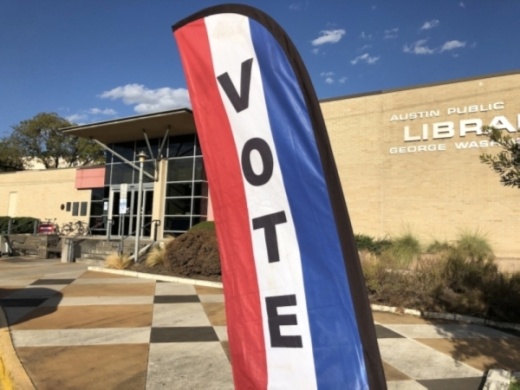 A sign guides voters inside at the George Washington Carver branch of the Austin Public Library during the fall 2019 election. (Jack Flagler/Community Impact Newspaper)