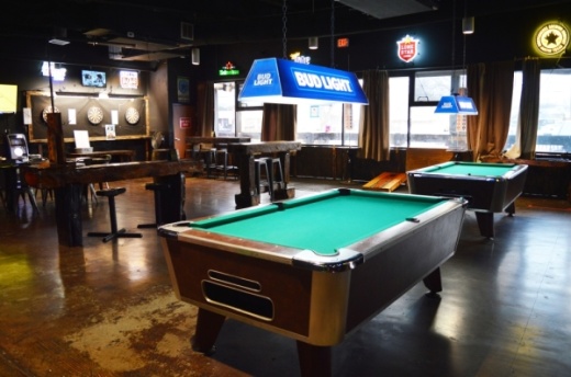 The Local Outpost always has something for its patrons to do with billiards tables, dart boards and live music on the weekends. (Iain Oldman/Community Impact Newspaper)