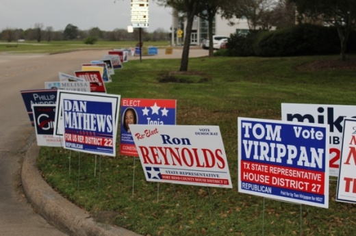 Candidates, including those running for Texas House District 27, advertise on signs outside of Missouri City City Hall. (Claire Shoop/Community Impact Newspaper)