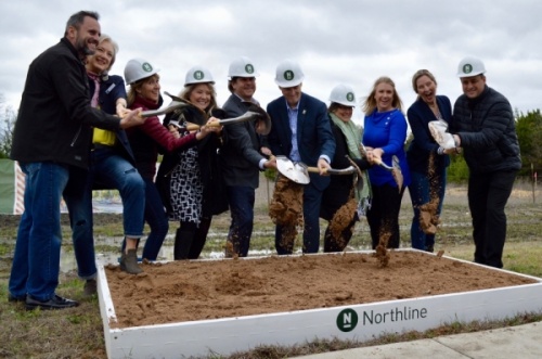 Leander City Council, developer Alex Tynberg, Williamson County Commissioner Cynthia Long and Leander Chamber of Commerce President Bridget Brandt broke ground at Northline on March 4. (Taylor Girtman/Community Impact Newspaper)
