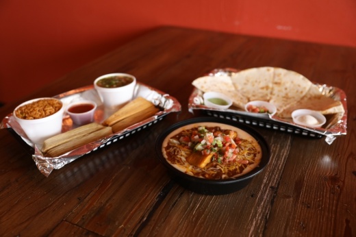 




Tommy Tamale dining options include the Tamale Plate ($6 for two, $8 for four), served with rice and beans; the Tommy Bowl ($7 one tamale, $9 two tamales), a beef chili, queso, pico and rice bowl with a choice of tamale; and quesadillas ($8 for one 12-inch, $12 for two),  which can include steak, tamale pork, chicken or beans and are served with sour cream, salsa and pico de gallo. (Photos by Liesbeth Powers/Community Impact Newspaper)