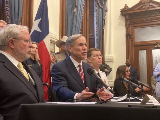 Dr. John Hellerstedt, commissioner of the Texas Department of State Health Services, left, and Gov. Greg Abbott addressed the media from the Texas Capitol on March 13. (Brian Rash/Community Impact Newspaper)