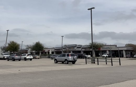 The parking lot at Richardson's Chinatown development was nearly vacant midday March 16. (Tracy Ruckel/Community Impact Newspaper)