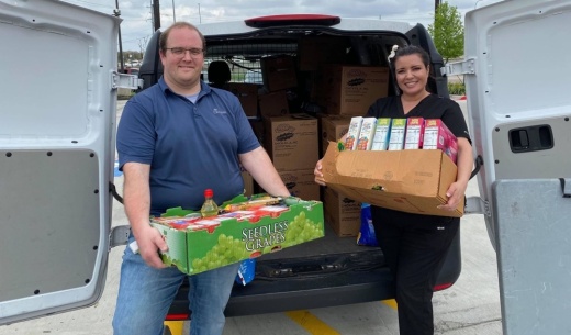 COVID-19 North Texas Relief group members Joel Upton and Adrianne Hudson load food collected March 18 for a senior living facility in Denton County. (Courtesy Adrianne Hudson)