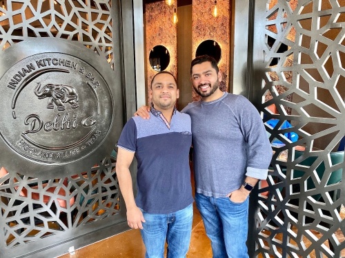AJ (left) and VJ (right) Jain, owners of Delhi 6 Indian Kitchen, have started providing to-go and delivery orders while dine-in services are temporarily shut down. (Courtesy Delhi 6 Indian Kitchen)