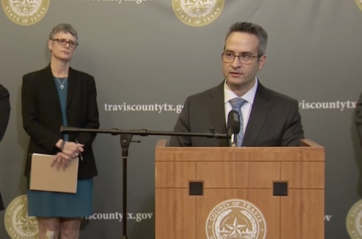 A photo of Sarah Eckhardt and Mark Escott at a press conference