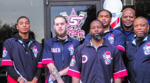 Demetrius Ennett (third from left) owns 5 Star Cutz, which is currently closed due to coronavirus concerns. (Gavin Pugh/Community Impact Newspaper)