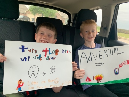 Two students whose mother works for Robertson Elementary School made signs to bring for the Frisco ISD car parade. (Courtesy Kyla Prusak)
