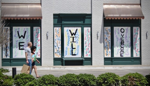 The windows at Goodnight Hospitality’s property on Westheimer Road were boarded up with a message of hope for the small-business community. (Matt Dulin/Community Impact Newspaper)